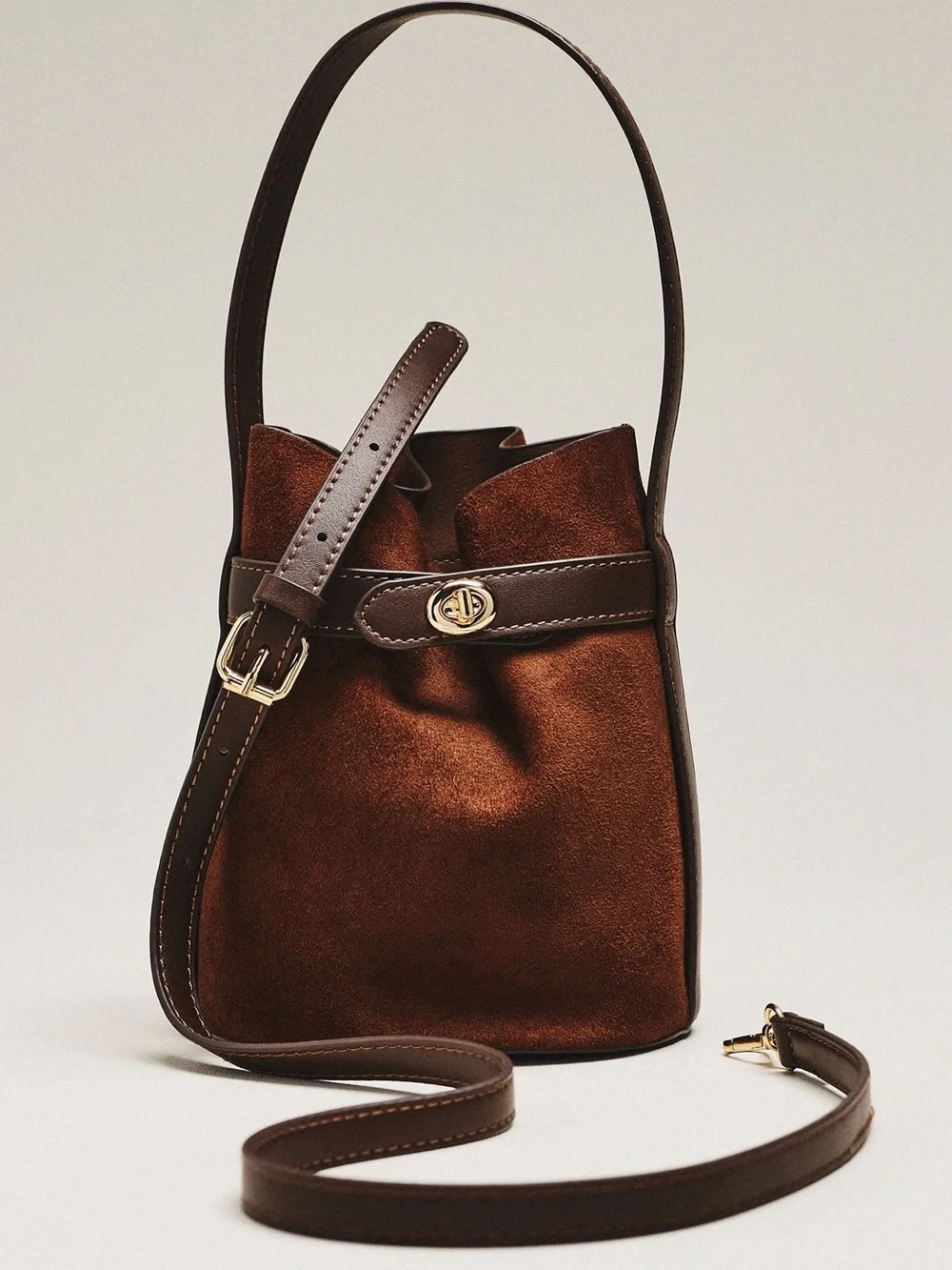 Anthropologie Brown faux suede bucket bag with leather strap and leather pouch